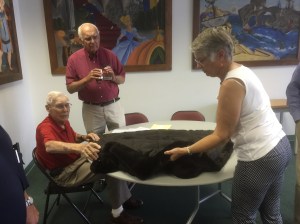 Attendees examine a fur